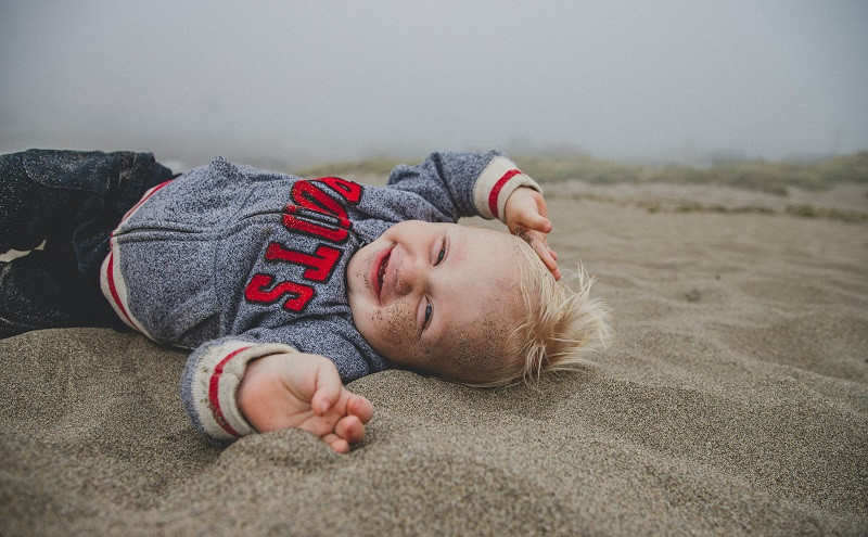 What does a baby indicate when he smiles?