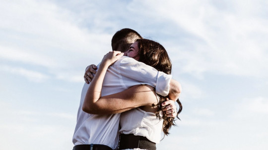 Couple hugging.