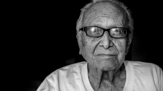 Elderly person with glasses.