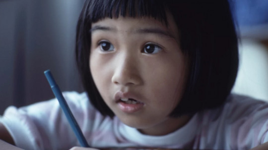 Little girl writing.