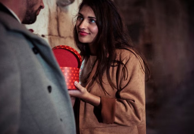 How does the charmer or love-bomber act?