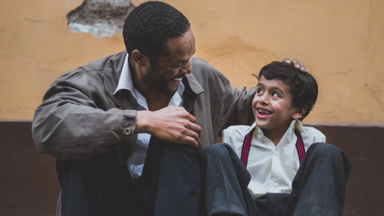 Father and son on the street.