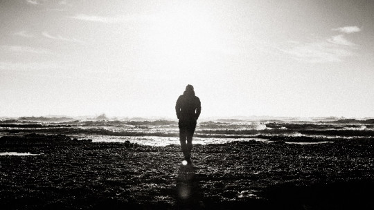 man in dark landscape