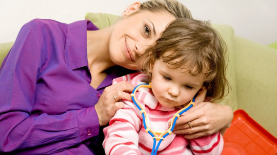 Happy mother with her little girl.