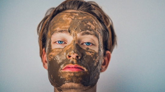 Man with his face smeared in chocolate.