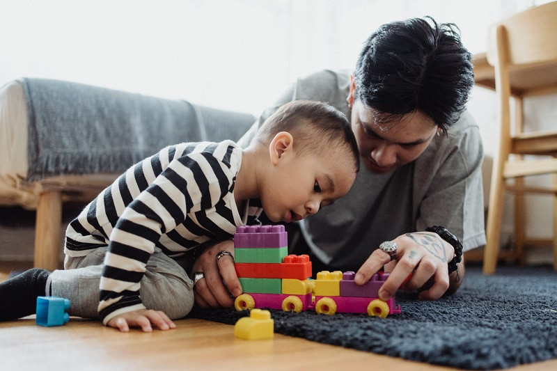 Father and son playing