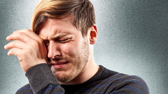 Young man crying.