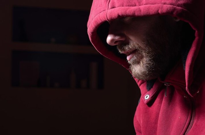 What does the "tough guy" script cost men themselves?