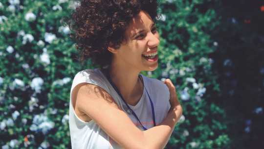 Young woman laughing.