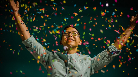 Happy man celebrating at a party.