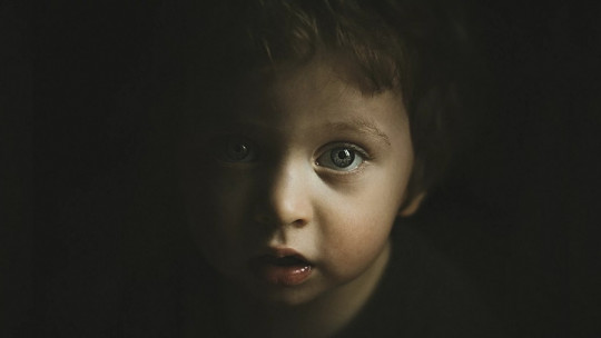 Child in the dark.